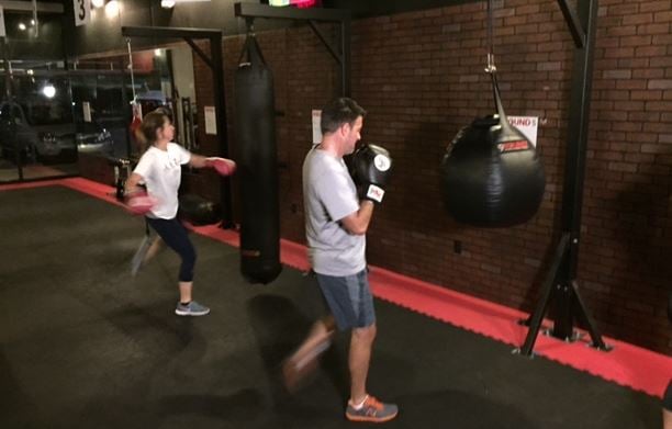 People work out inside a Greenville 9Round gym (FOX Carolina)