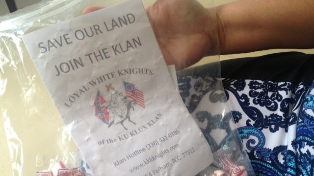 The flyer and bag of candy dropped in a Seneca woman's driveway. (July 14, 2014/FOX Carolina)