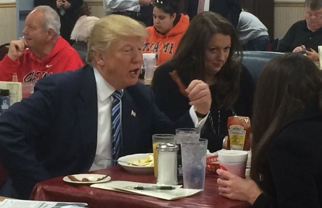 Donald trump enjoys bacon at Tommy's Ham House (FOX Carolina/ Feb. 16, 2016).